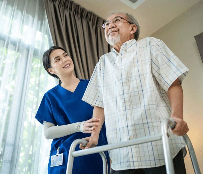 A nurse providing complex care support in a participant's home