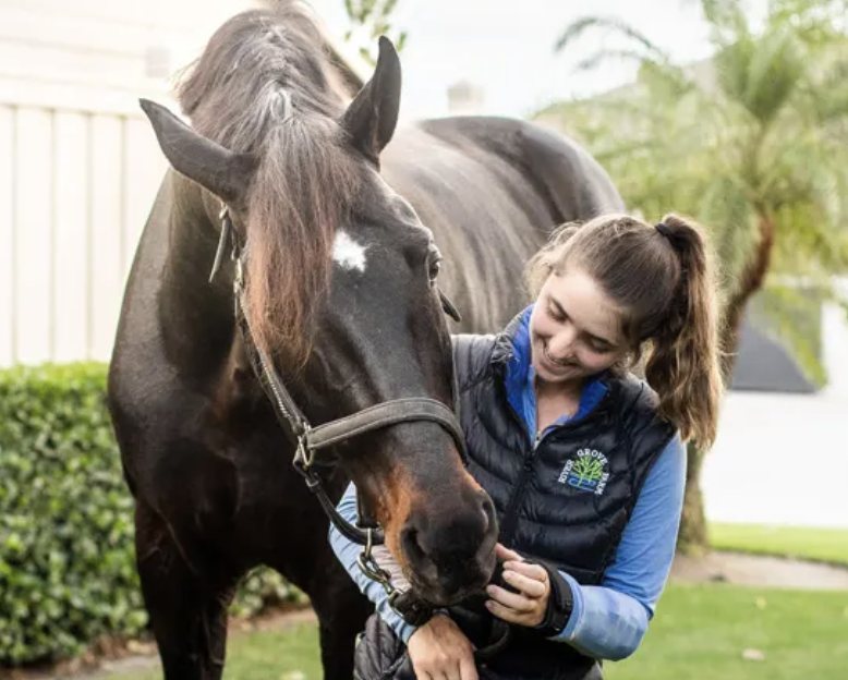 A participant taking part in equine therapy