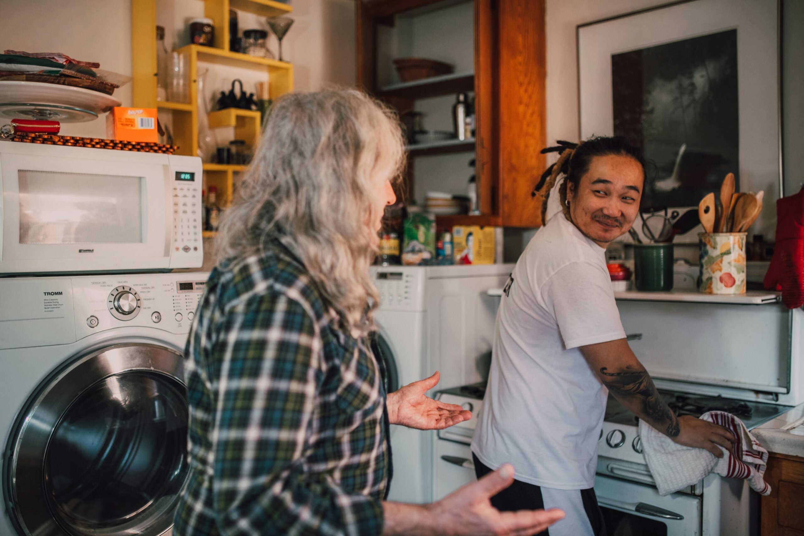 A support worker helping with laundry and household tasks