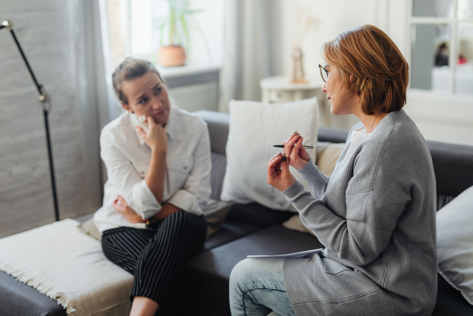 A support worker listening to a participant in conversation